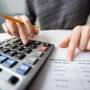 closeup-accountant-hands-counting-calculator.jpg